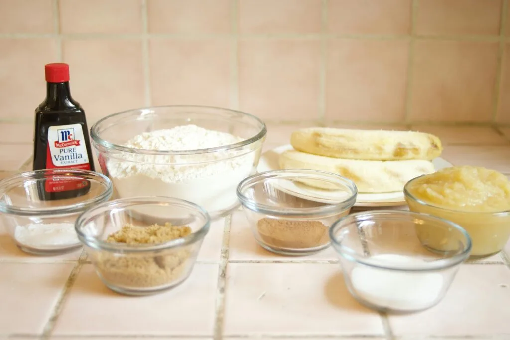 Delicious Easter Recipes with Egg Substitutes 4 | eat move healthy A collection of ingredients for baking banana bread, including flour, bananas, and vanilla.