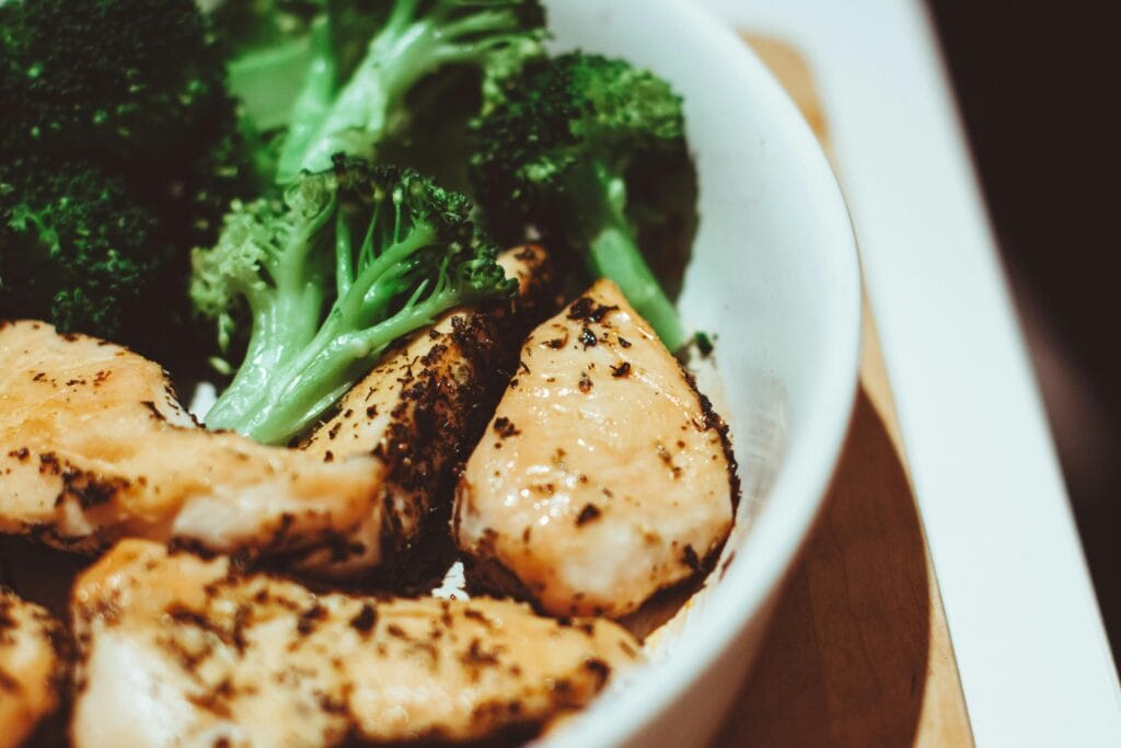 30 Day Fitness Challenge 8 | eat move healthy Close-up of a healthy homemade chicken and broccoli dish, perfect for a nutritious meal.