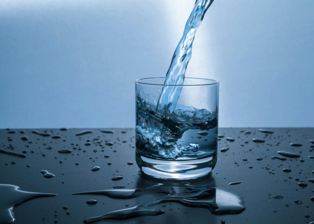 10 Surprising Health Facts You’ve Never Heard 3 | eat move healthy High-quality image of water being poured into a glass, illustrating hydration and purity.